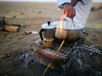 Man preparing coffee outdoors