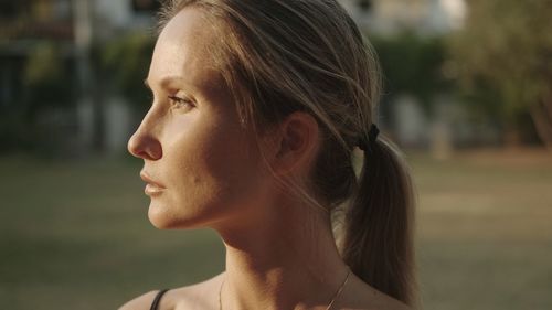 Close-up of young woman looking away