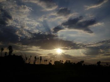 Scenic view of landscape against sky at sunset