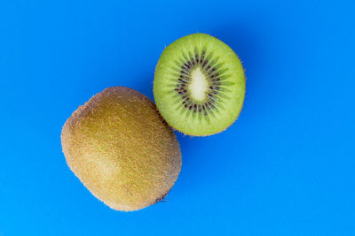 Close-up of fruits against blue background