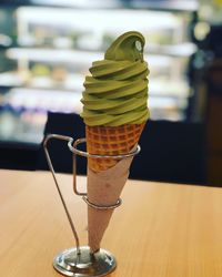 Close-up of ice cream cone on table