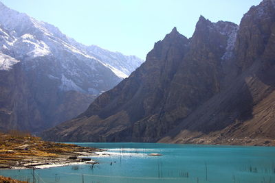 Scenic view of lake and mountains against sky