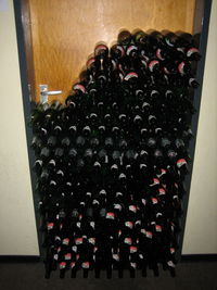 Row of wine bottles in container
