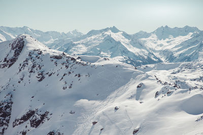 Scenic view of snow mountains against clear sky