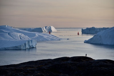 Scenic view of sea against sky during winter