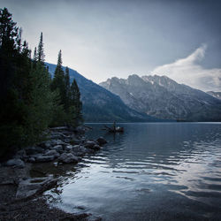 Scenic view of lake and mountains against sky