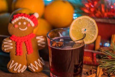 Close-up of drink and gingerbread cookie on table