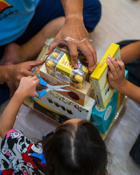 High angle view of children playing on table