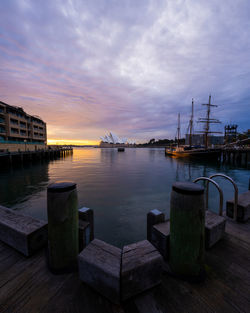 Scenic view of sea against sky during sunrise. sydney harbour. beautiful wooden ship