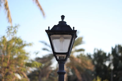 Low angle view of street light against sky