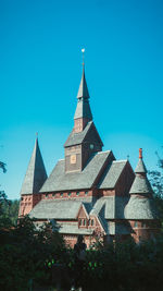 Low angle view of building against clear blue sky