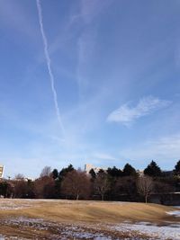 Scenic view of landscape against blue sky