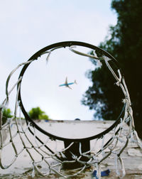 Close-up of basketball hoop against sky