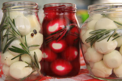 Close-up of fruits in glass jar on table