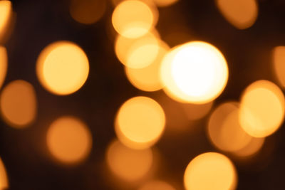 Defocused image of illuminated lights at night