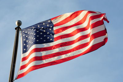 Low angle view of flag against clear sky