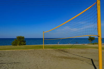 Scenic view of beach against blue sky