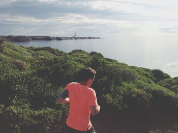 Rear view of woman looking at sea