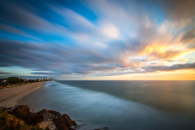 Scenic view of sea against sky at sunset