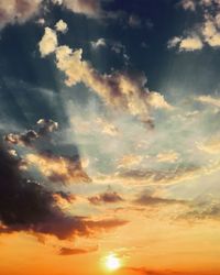 Low angle view of dramatic sky during sunset