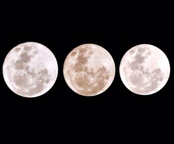 Close-up of full moon against sky at night