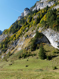 Scenic view of rocky mountains against clear blue sky