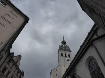 Low angle view of buildings against sky in city