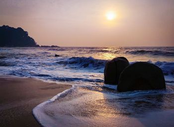 Scenic view of sea against sky during sunset