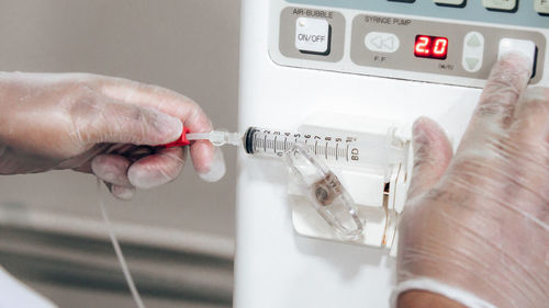 Close-up of hand holding machine