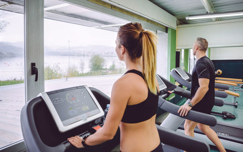 People walking on treadmills in gym