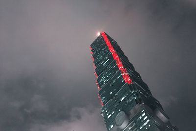 Low angle view of illuminated built structure against sky