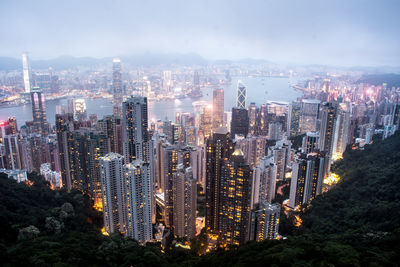 High angle view of illuminated buildings in city against sky