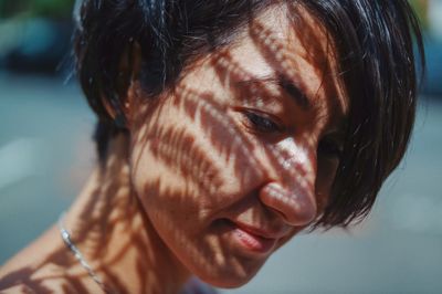 Close-up of woman looking down