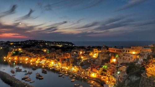 High angle view of illuminated buildings in city at night