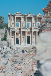 Low angle view of old ruins against sky