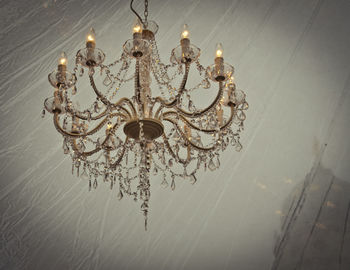 Low angle view of illuminated chandelier