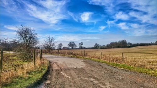 Road passing through field