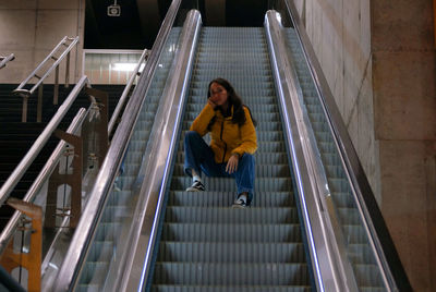 Portrait of woman on escalator