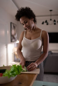 African american woman cooking healthy dinner