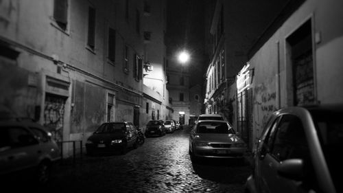 Cars on illuminated city at night