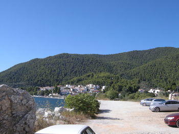 Scenic view of mountains against clear blue sky