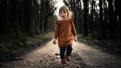 Full length of boy in forest