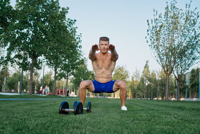 Side view of man exercising in park