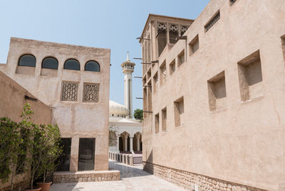 Low angle view of buildings against clear sky