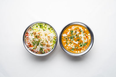 High angle view of food on table against white background