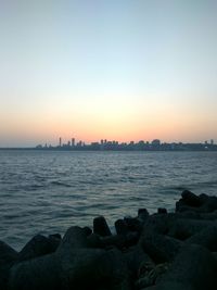 Scenic view of sea against clear sky during sunset