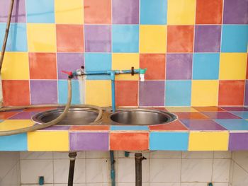 Sink against colorful wall