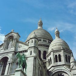 Low angle view of church against blue sky