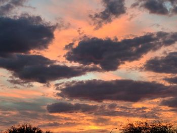 Low angle view of dramatic sky during sunset