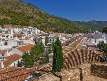 High angle view of townscape against blue sky